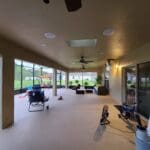 A large open porch with lots of windows.